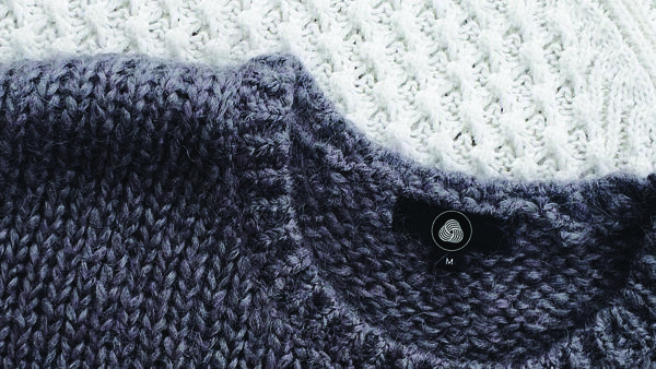 a wool sweater bearing the Woolmark symbol