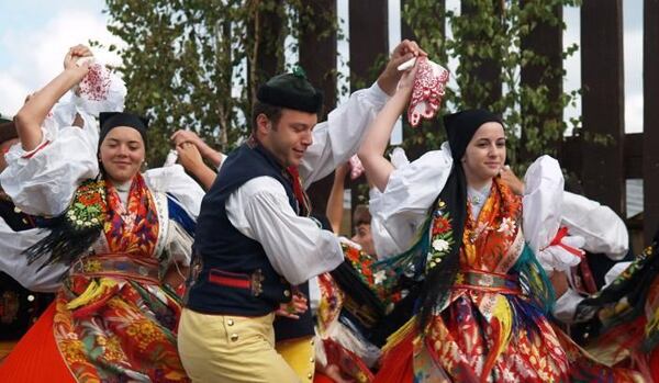 Dancers twirling in Chod kroj at the annual folk festival