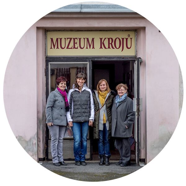 In front of the museum of folk costumes in Postrekov